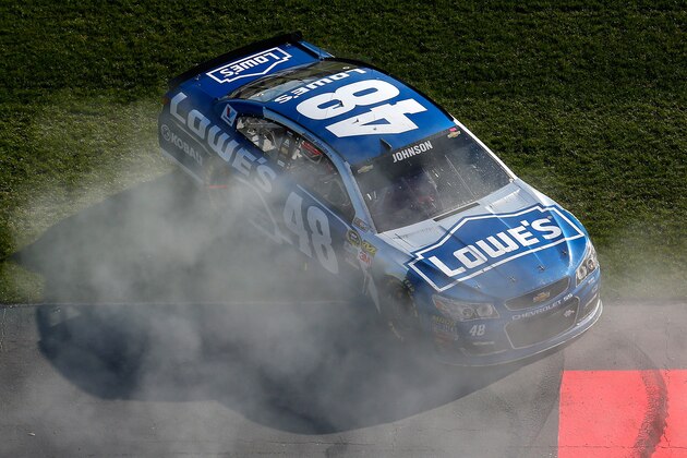 HAMPTON, GA - FEBRUARY 28:  Jimmie Johnson, driver of the #48 Lowe's Chevrolet, celebrates with a burnout after winning the NASCAR Sprint Cup Series Folds of Honor QuikTrip 500 at Atlanta Motor Speedway on February 28, 2016 in Hampton, Georgia.  (Photo by Kevin C. Cox/Getty Images)