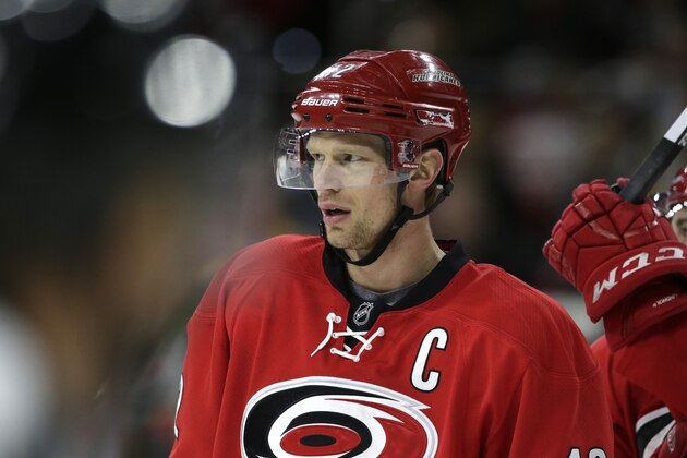 Carolina Hurricanes' Eric Staal (12) waits to go into the game during the first period of an NHL hockey game against the Boston Bruins  in Raleigh, N.C., Friday, Feb. 26, 2016. (AP Photo/Gerry Broome)