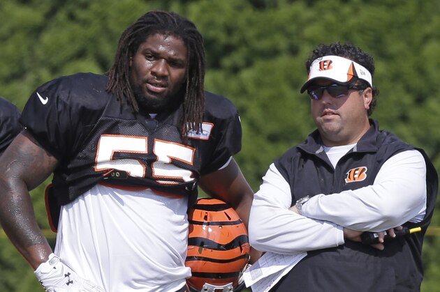 Cincinnati Bengals outside linebacker Vontaze Burfict (55) talks with defensive coordinator Paul Guenther during practice at the NFL football team's training camp, Thursday, July 31, 2014, in Cincinnati.  (AP Photo/Al Behrman)