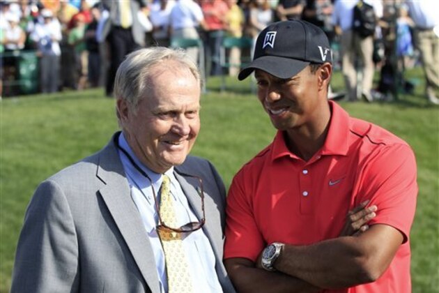 Jack Nicklaus, left, talks with Tiger Woods after Woods won the Memorial golf tournament at the Muirfield Village Golf Club in Dublin, Ohio, Sunday, June 3, 2012. (AP Photo/Tony Dejak)