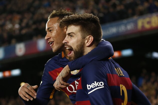 FC Barcelona's Gerard Pique, right, celebrates with his teammate Neymar after scoring against Athletic Bilbao during a quarterfinal, second leg, Copa del Rey soccer match at the Camp Nou stadium in Barcelona, Spain, Wednesday, Jan. 27, 2016. (AP Photo/Manu Fernandez)