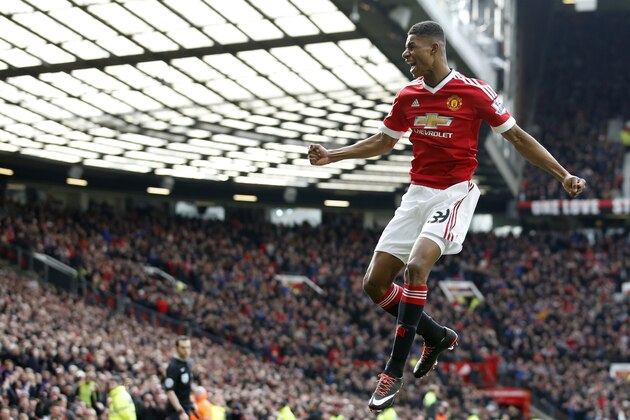 Manchester United's Marcus Rashford, celebrates after he sores the opening goal of the game during the English Premier League soccer match between Manchester United and Arsenal at Old Trafford Stadium, Manchester, England, Sunday, Feb. 28, 2016. (AP Photo/Jon Super)
