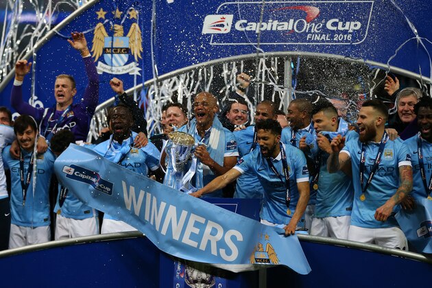 LONDON, ENGLAND - FEBRUARY 28 : Vincent Kompany of Manchester City lifts the cup as Manchester City celebrate with the Capital One cup trophy after the Capital One Cup Final match between Liverpool and Manchester City at Wembley Stadium on February 28, 2016 in London, England. (Photo by Catherine Ivill - AMA/Getty Images) LONDON, ENGLAND - FEBRUARY 28 : Vincent Kompany of Manchester City lifts the cup as Manchester City celebrate with the Capital One cup trophy after the Capital One Cup Final match between Liverpool and Manchester City at Wembley Stadium on February 28, 2016 in London, England. (Photo by Catherine Ivill - AMA/Getty Images)