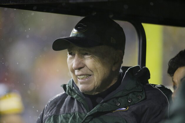 Bart Starr and wife Cherry Louise Morton attend a Brett Favre ceremony at halftime of an NFL football game between the Green Bay Packers and Chicago Bears Thursday, Nov. 26, 2015, in Green Bay, Wis. Favre's retired No. 4 and name were unveiled inside Lambeau Field during the ceremony. (AP Photo/Jeffrey Phelps)