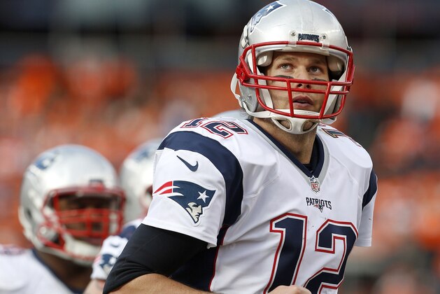 New England Patriots quarterback Tom Brady looks at the scoreboard as he runs off the field during the first half of the NFL football AFC Championship game between the Denver Broncos and the New England Patriots, Sunday, Jan. 24, 2016, in Denver. (AP Photo/Joe Mahoney)
