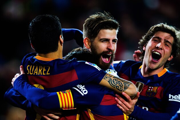 BARCELONA, SPAIN - FEBRUARY 28:  Gerard Pique of Barcelona is celebrated by his team after scoring his team's second goal during the La Liga match between FC Barcelona and Sevilla FC at Camp Nou on February 28, 2016 in Barcelona, Spain.  (Photo by Vladimir Rys Photography via Getty Images)