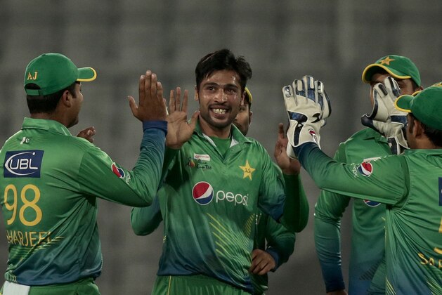 Pakistan’s Mohammad Amir, center, celebrates with his teammates the wicket of United Arab Emirates’ Muhammad Kaleem during their Asia Cup Twenty20 international cricket match in Dhaka, Bangladesh, Monday, Feb. 29, 2016. (AP Photo/A.M. Ahad)