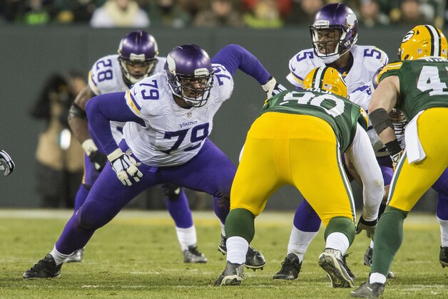 GREEN BAY, WI - JANUARY 3: Michael Harris #79 of the Minnesota Vikings blocks during an NFL game against the Green Bay Packers at Lambeau Field January 3, 2016 in Green Bay, Wisconsin.  (Photo by Tom Dahlin/Getty Images)