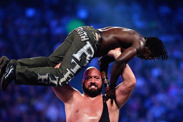 The Big Show holds R-Truth above his head during Wrestlemania XXX at the Mercedes-Benz Super Dome in New Orleans on Sunday, April 6, 2014. (Jonathan Bachman/AP Images for WWE)