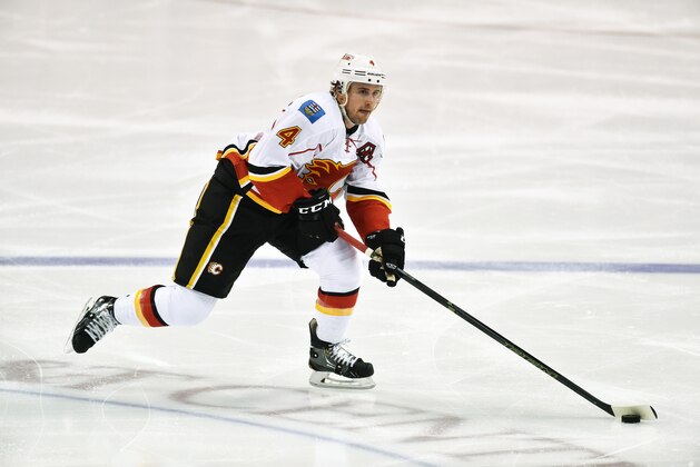 SUNRISE, FL - NOVEMBER 10:  Kris Russell #4 of the Calgary Flames skates with the puck during a NHL game against the Florida Panthers at the BB&T Center on November 10, 2015 in Sunrise, Florida.  (Photo by Ronald C. Modra/NHL/Getty Images)