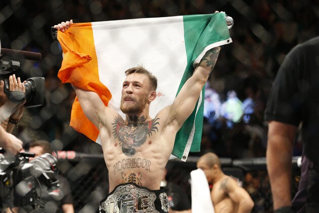 Conor McGregor reacts after defeating Jose Aldo during a featherweight championship mixed martial arts bout at UFC 194, Saturday, Dec. 12, 2015, in Las Vegas. (AP Photo/John Locher)