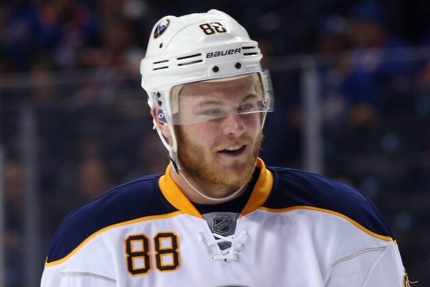 NEW YORK, NY - NOVEMBER 01: Jamie McGinn #88 of the Buffalo Sabres skates against the New York Islanders at the Barclays Center on November 1, 2015 in the Brooklyn borough of New York City. The Sabres defeated the Islanders 2-1.  (Photo by Bruce Bennett/Getty Images)
