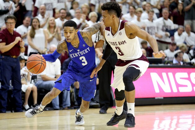 Kentucky's Tyler Ulis (3) drives past Texas A&M's Admon Gilder (3) during the second half of an NCAA college basketball game, Saturday, Feb. 20, 2016, in College Station, Texas. Texas A&M won 79-77. (AP Photo/Sam Craft)