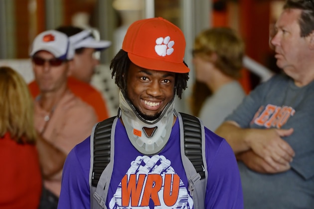 Clemson's injured receiver Mike Williams wears a protective neck brace and visits with fans after Clemson's 41-10 win over Appalachian State in an NCAA college football  game against  Saturday,  Sept. 12, 2015,  in Clemson, S.C. (AP Photo/Richard Shiro)