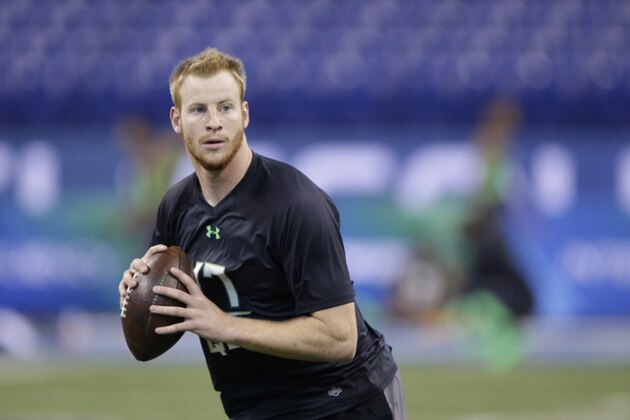 North Dakota State quarterback Carson Wentz runs a drill at the NFL football scouting combine on Saturday, Feb. 27, 2016, in Indianapolis. (AP Photo/Darron Cummings)
