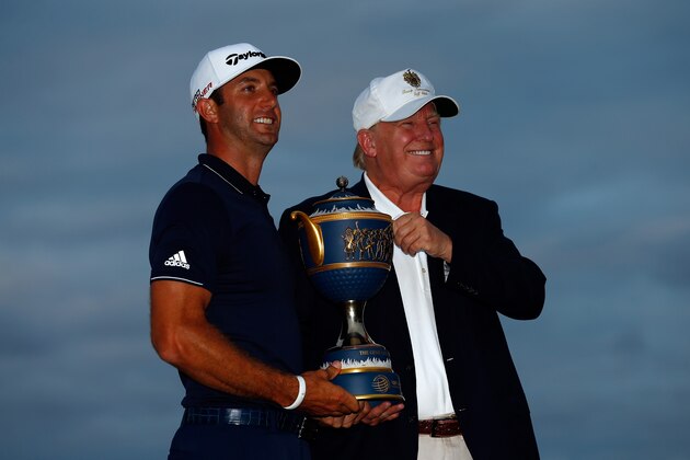 DORAL, FL - MARCH 08:  Dustin Johnson of the United States and Donald Trump pose with the Gene Sarazen Cup after winning the World Golf Championships-Cadillac Championship at Trump National Doral Blue Monster Course on March 8, 2015 in Doral, Florida.  (Photo by Sam Greenwood/Getty Images)