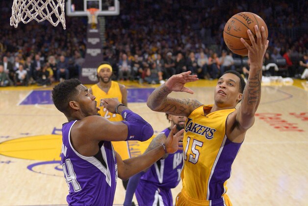 Los Angeles Lakers guard Jabari Brown, right, shoots as Sacramento Kings forward Jason Thompson defends during the second half of an NBA basketball game, Wednesday, April 15, 2015, in Los Angeles. The Kings won 122-99. (AP Photo/Mark J. Terrill)