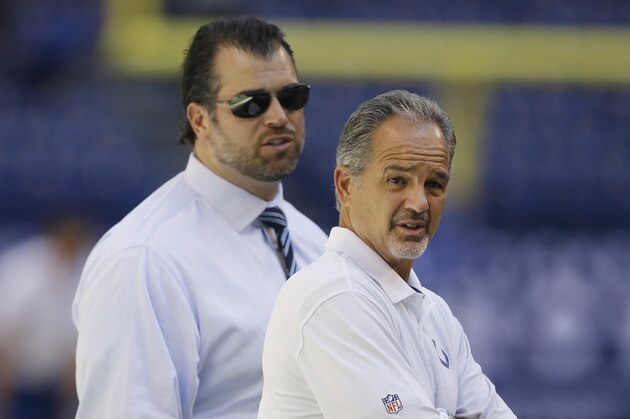 FILE - In this Sept. 28, 2014, file phot,o Indianapolis Colts general manager Ryan Grigson, left, and head coach Chuck Pagano walk on the field before an NFL football game against  the Tennessee Titans in Indianapolis. Pagano’s contract is about to expire after turning down a one-year extension during the offseason, while Grigson has a year remaining himself. Owner Jim Irsay may not be able to stop himself from chasing a new coach to get him back to the Super Bowl. (AP Photo/Darron Cummings, File)