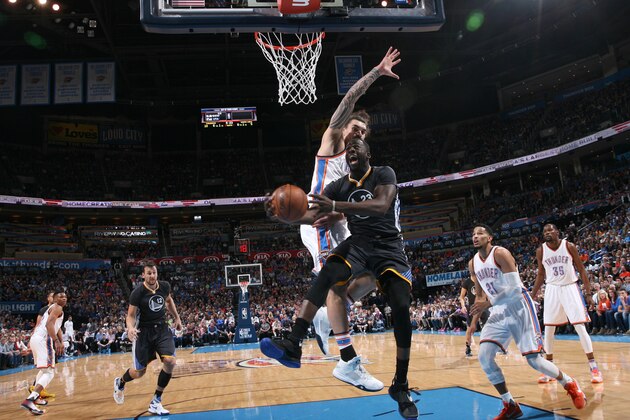 OKLAHOMA CITY, OK - FEBRUARY 27: Draymond Green #23 of the Golden State Warriors drives to the basket against the Oklahoma City Thunder on February 26, 2016 at the Chesapeake Energy Arena in Oklahoma City, Oklahoma. NOTE TO USER: User expressly acknowledges and agrees that, by downloading and or using this Photograph, user is consenting to the terms and conditions of the Getty Images License Agreement. Mandatory Copyright Notice: Copyright 2016 NBAE (Photo by Layne Murdoch/NBAE via Getty Images)