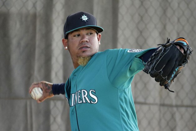 Seattle Mariners starting pitcher Felix Hernandez throws during spring training baseball practice Saturday, Feb. 27, 2016, in Peoria, Ariz. (AP Photo/Charlie Riedel)