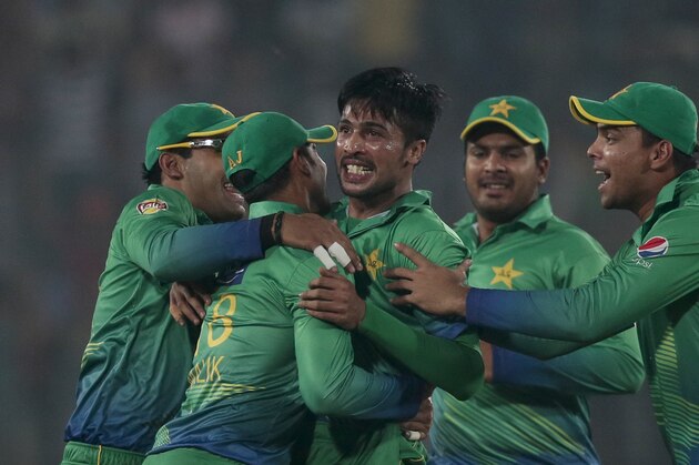 Pakistan’s Mohammad Amir, center, celebrates with his teammates after the dismissal of India’s Suresh Raina, unseen, during the Asia Cup Twenty20 international cricket match between them in Dhaka, Bangladesh, Saturday, Feb. 27, 2016. (AP Photo/A.M. Ahad)