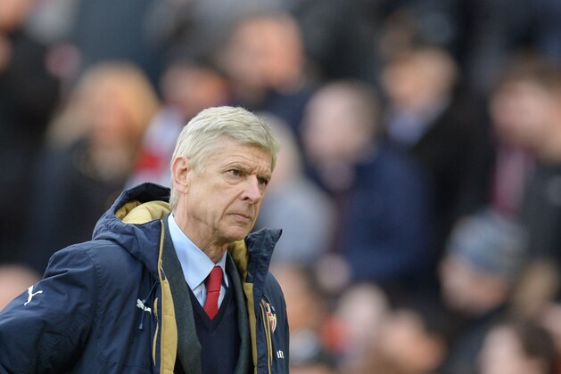 Arsenal's French manager Arsene Wenger leads off his team at the end of the English Premier League football match between Manchester United and Arsenal at Old Trafford in Manchester in north west England on February 28, 2016. / AFP / OLI SCARFF / RESTRICTED TO EDITORIAL USE. No use with unauthorized audio, video, data, fixture lists, club/league logos or 'live' services. Online in-match use limited to 75 images, no video emulation. No use in betting, games or single club/league/player publications.  /         (Photo credit should read OLI SCARFF/AFP/Getty Images)