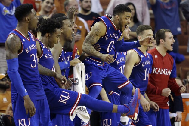 Kansas guard Frank Mason III (0) leaps in the air as he and teammates celebrate a score against Texas during the second half of an NCAA college basketball game, Monday, Feb. 29, 2016, in Austin, Texas. Kansas won 86-56. (AP Photo/Eric Gay) Kansas guard Frank Mason III (0) leaps in the air as he and teammates celebrate a score against Texas during the second half of an NCAA college basketball game, Monday, Feb. 29, 2016, in Austin, Texas. Kansas won 86-56. (AP Photo/Eric Gay)