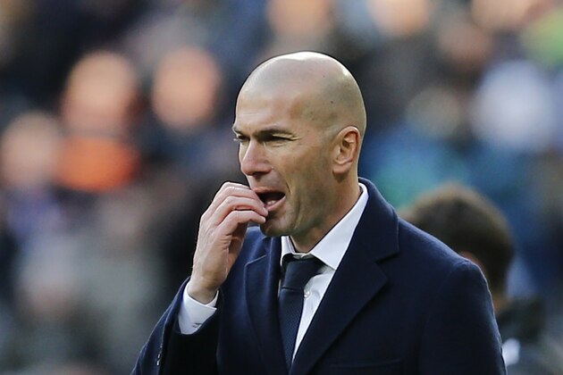 Real Madrid's headcoach Zinedine Zidane watches the Spanish La Liga soccer match between Real Madrid and Atletico Madrid at the Santiago Bernabeu stadium in Madrid, Spain, Saturday Feb. 27, 2016. Atletico won the match 1-0.  (AP Photo/Paul White)