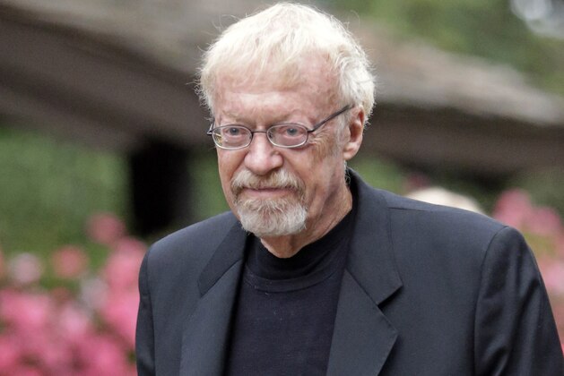 FILE - In this July 11, 2013 file photo, Phil Knight, the co-founder and chairman of Nike, Inc., walks to the morning session at the Allen & Company Sun Valley Conference in Sun Valley, Idaho. Scribner announced that