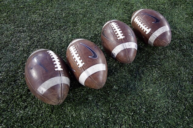 Footballs sit on the field before an NCAA college football game between Memphis and Houston Saturday, Nov. 14, 2015, in Houston. (AP Photo/David J. Phillip)