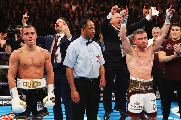 MANCHESTER, ENGLAND - FEBRUARY 27:  Carl Frampton (2R) celebrates a points victory over Scott Quigg (L) as his manager Barry McGuigan (4L) reacts after their World Super-Bantamweight title contest at Manchester Arena on February 27, 2016 in Manchester, England. Frampton's victory united the WBA and IBF titles.  (Photo by Alex Livesey/Getty Images)