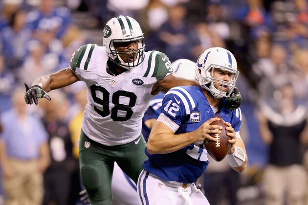 INDIANAPOLIS, IN - SEPTEMBER 21:  Andrew Luck #12  of the Indianapolis Colts is sacked by Quinton Coples #98 during the game against the New York Jets  at Lucas Oil Stadium on September 21, 2015 in Indianapolis, Indiana.  (Photo by Andy Lyons/Getty Images)