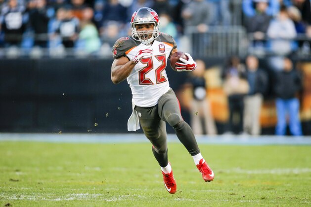 Tampa Bay Buccaneers running back Doug Martin (22) runs the ball against the Carolina Panthers during an NFL game in Charlotte, N.C. on Sunday, Jan. 3, 2016. (Chris Keane/AP Images for Panini)