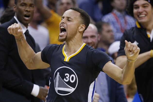 Golden State Warriors guard Stephen Curry (30) celebrates after hitting the game-winning shot in overtime of an NBA basketball game against the Oklahoma City Thunder in Oklahoma City, Saturday, Feb. 27, 2016. Golden State won 121-118. (AP Photo/Sue Ogrocki)