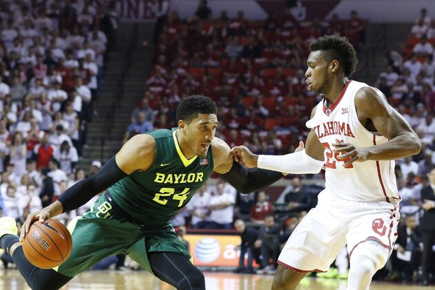 Baylor guard Ishmail Wainright, left, drives to the basket as Oklahoma guard Buddy Hield defends during the first half of an NCAA college basketball game in Norman, Okla., Tuesday, March 1, 2016. (AP Photo/Alonzo Adams)