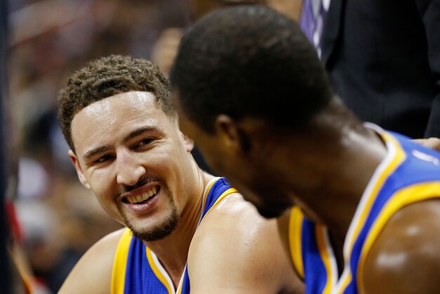 Feb 3, 2016; Washington, DC, USA; Golden State Warriors guard Klay Thompson (L) smiles on the bench with Warriors forward Harrison Barnes (R) against the Washington Wizards at Verizon Center. Mandatory Credit: Geoff Burke-USA TODAY Sports