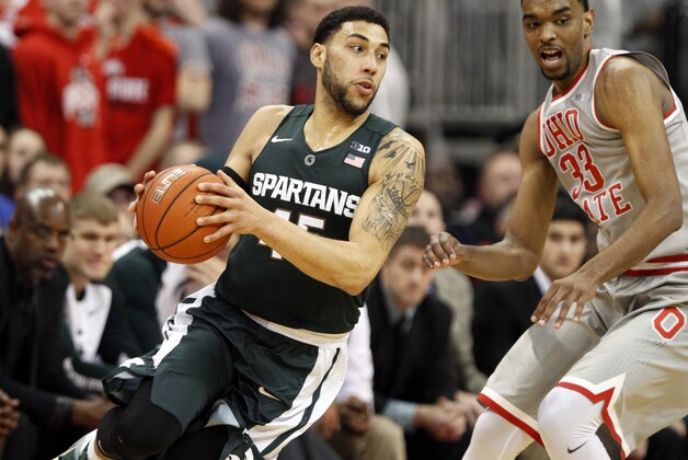 Michigan State's Denzel Valentine, left, works against Ohio State's Keita Bates-Diop during an NCAA college basketball game in Columbus, Ohio, Wednesday, Feb. 23, 2016. Michigan State won 81-62. (AP Photo/Paul Vernon)