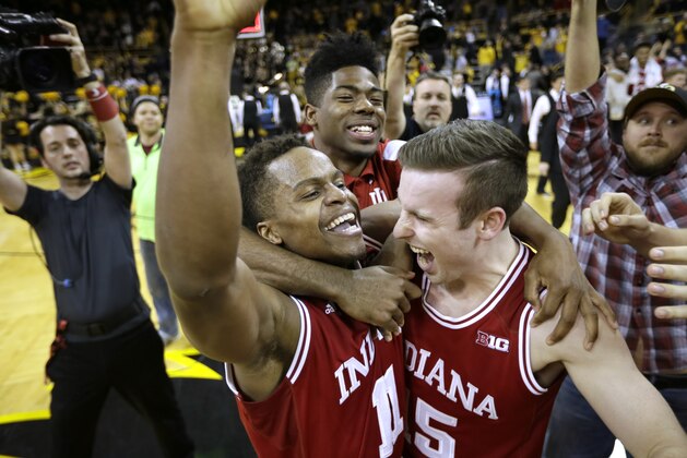Indiana guard Yogi Ferrell celebrates with teammate Harrison Niego, right, after an NCAA college basketball game against Iowa, Tuesday, March 1, 2016, in Iowa City, Iowa. Ferrell scored 20 points as Indiana won 81-78 and clinched the Big Ten title. (AP Photo/Charlie Neibergall)