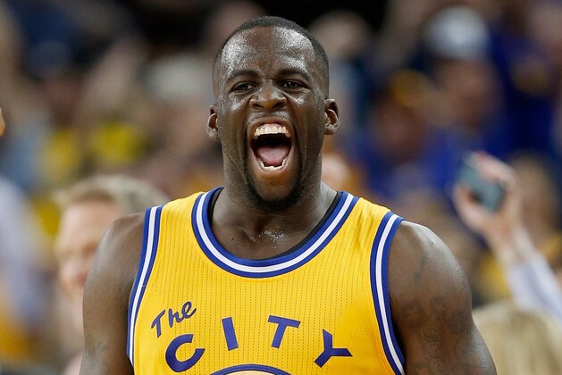 OAKLAND, CA - MARCH 01:  Draymond Green #23 of the Golden State Warriors reacts after making a three-point basket in overtime against the Atlanta Hawks at ORACLE Arena on March 1, 2016 in Oakland, California. NOTE TO USER: User expressly acknowledges and agrees that, by downloading and or using this photograph, User is consenting to the terms and conditions of the Getty Images License Agreement.  (Photo by Ezra Shaw/Getty Images)
