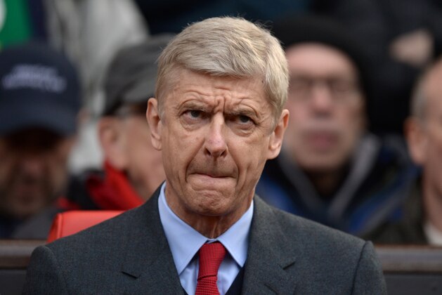 Arsenal's French manager Arsene Wenger takes his seat for the English Premier League football match between Manchester United and Arsenal at Old Trafford in Manchester in north west England on February 28, 2016. / AFP / OLI SCARFF / RESTRICTED TO EDITORIAL USE. No use with unauthorized audio, video, data, fixture lists, club/league logos or 'live' services. Online in-match use limited to 75 images, no video emulation. No use in betting, games or single club/league/player publications.  /         (Photo credit should read OLI SCARFF/AFP/Getty Images)