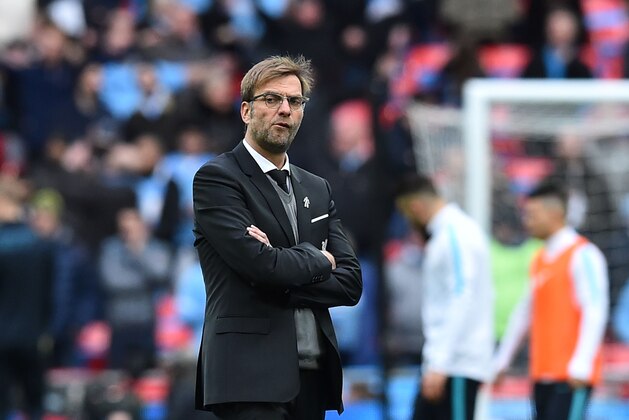 Liverpool's German manager Jurgen Klopp walks on the pitch as his players warm up ahead of the League Cup final football match between Liverpool and Manchester City at Wembley Stadium in London on February 28, 2016. / AFP / Ben STANSALL / RESTRICTED TO EDITORIAL USE. No use with unauthorized audio, video, data, fixture lists, club/league logos or 'live' services. Online in-match use limited to 75 images, no video emulation. No use in betting, games or single club/league/player publications.  /         (Photo credit should read BEN STANSALL/AFP/Getty Images)
