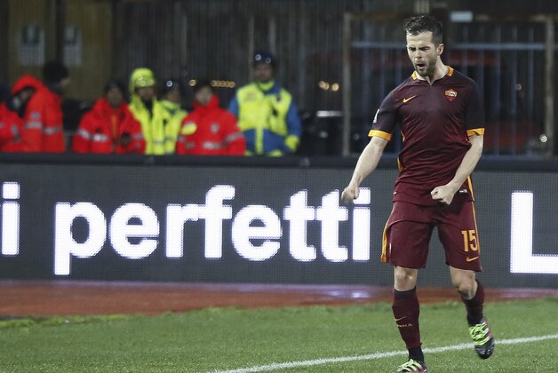 Roma midfielder Miralem Pjanic celebrates after scoring during a Serie A soccer match between Roma and Empoli, in Empoli, Italy, Saturday, Feb. 27, 2016. (Fabio Muzzi/ANSA via AP)