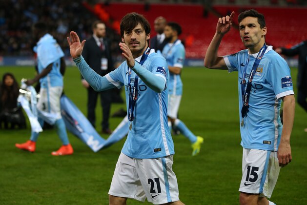 LONDON, ENGLAND - FEBRUARY 28 : David Silva of Manchester City and Jesus Navas of Manchester City celebrate after the Capital One Cup Final match between Liverpool and Manchester City at Wembley Stadium on February 28, 2016 in London, England. (Photo by Catherine Ivill - AMA/Getty Images) LONDON, ENGLAND - FEBRUARY 28 : David Silva of Manchester City and Jesus Navas of Manchester City celebrate after the Capital One Cup Final match between Liverpool and Manchester City at Wembley Stadium on February 28, 2016 in London, England. (Photo by Catherine Ivill - AMA/Getty Images)