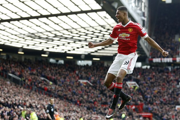 Manchester United's Marcus Rashford, celebrates after he sores the opening goal of the game during the English Premier League soccer match between Manchester United and Arsenal at Old Trafford Stadium, Manchester, England, Sunday, Feb. 28, 2016. (AP Photo/Jon Super)
