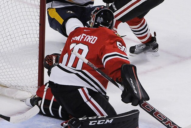 Nashville Predators right wing Viktor Arvidsson (38) scores a goal on Chicago Blackhawks goalie Corey Crawford (50) during the second period of an NHL hockey game Thursday, Feb. 25, 2016, in Chicago. (AP Photo/David Banks)