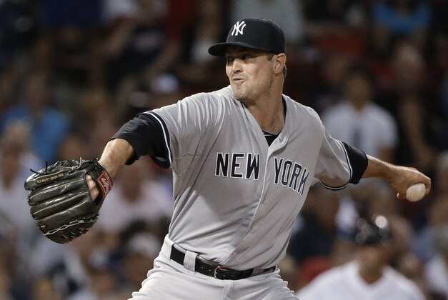 New York Yankees reliever Andrew Miller winds up for a pitch during the ninth inning of a baseball game against the Boston Red Sox, Tuesday, Sept. 1, 2015, at Fenway Park, in Boston. The Yankees won 3-1. (AP Photo/Steven Senne)