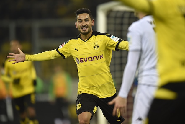 Dortmund's Ilkay Gundogan celebrates after scoring his side's third goal during the German Bundesliga soccer match between Borussia Moenchengladbach and Borussia Dortmund in Moenchengladbach, Germany, Saturday, Jan. 23, 2016. (AP Photo/Martin Meissner)