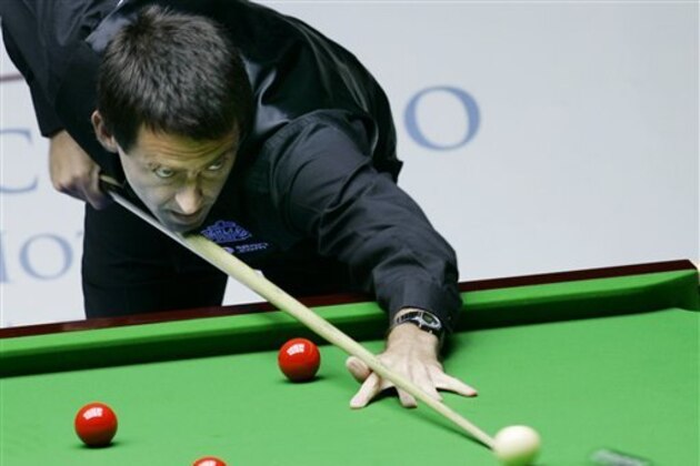 FILE - In this Thursday, July 12, 2007 file photo Ronnie O'Sullivan of England aims a shot during an invitation match against Supoj Saenla of Thailand during the