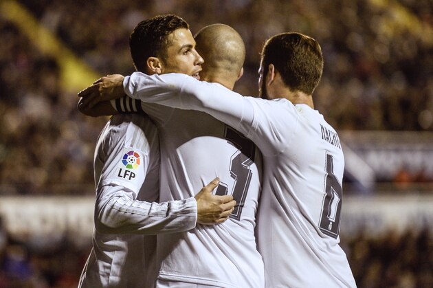 Real Madrid's Portuguese forward Cristiano Ronaldo celebrates a goal with teammates during the Spanish league football match Levante UD vs Real Madrid CF at the Ciutat de Valencia stadium in Valencia on March 2, 2016. / AFP / JOSE JORDAN        (Photo credit should read JOSE JORDAN/AFP/Getty Images)