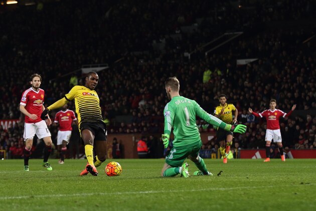 MANCHESTER, ENGLAND - MARCH 02:  David de Gea of Manchester United makes a save from Odion Ighalo of Watford during the Barclays Premier League match between Manchester United and Watford at Old Trafford on March 02, 2016 in Manchester, England.  (Photo by Matthew Ashton - AMA/Getty Images)
